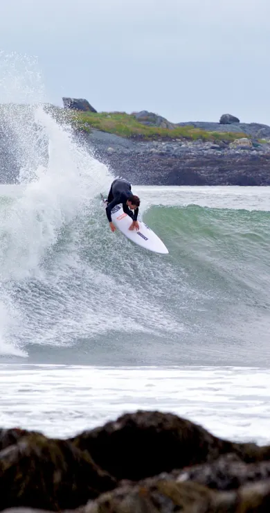 Carousel Slide Image of Andrew Mooney surfs eastern Canada