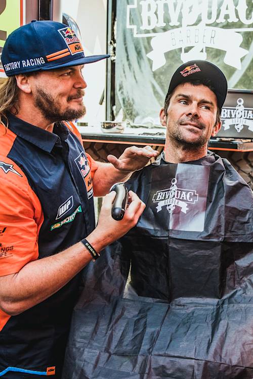 Toby Price gives Cyril Despres a fresh beard trim