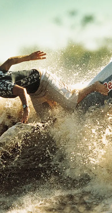Carousel Slide Image of Big Wave surfers at Pororoca
