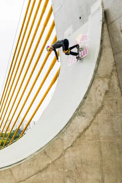 Carousel Slide Image of Sandro Dias rides São Paulo's Estaiadinha Bridge 45m above the ground