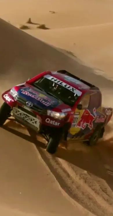 Carousel Slide Image of Racing on sand dunes with Nasser Al-Attiyah
